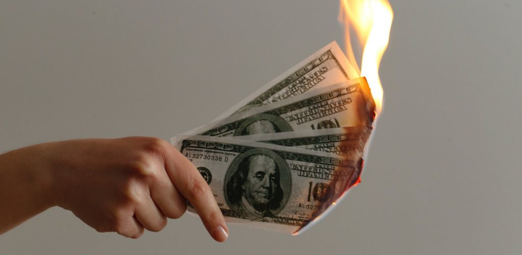 burned 100 US dollar banknotes